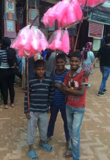 Friendly young faces. Not sure what they're selling, but it looks like cotton candy on steroids.