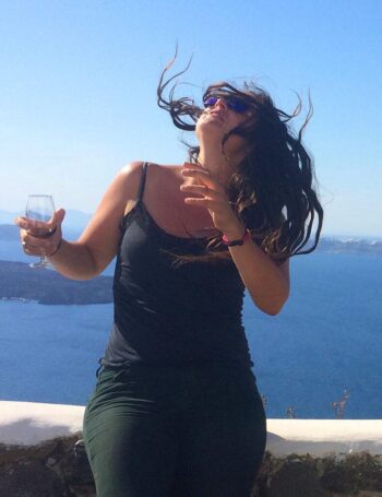 After a few cabernets, Phoebe goes into an ecstatic rock star trance at the Venetsanos Winery in Santorini. WHAT a VIEW! Watch the wine, honey, and seriously, don't lean back.