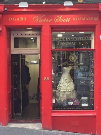 Storefront for Victor Scott Kiltmakers on Bow Street in central Edinburgh. That red is bold, classic, sexy, and just plain spectacular!