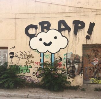 The message if pretty clear, but why a smiley cloud with blue legs and sneakers? I'd love to interview the artist and find out!