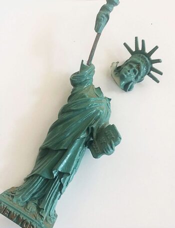 This magnet fell off the refrigerator door one day while I was working on a project, and Lady Liberty lost her head. I looked down, saw the severed head, and I immediately thought, "Wow, that is spot on spooky!" I don't think I glued it back on either, which is probably why we're still in this mess.